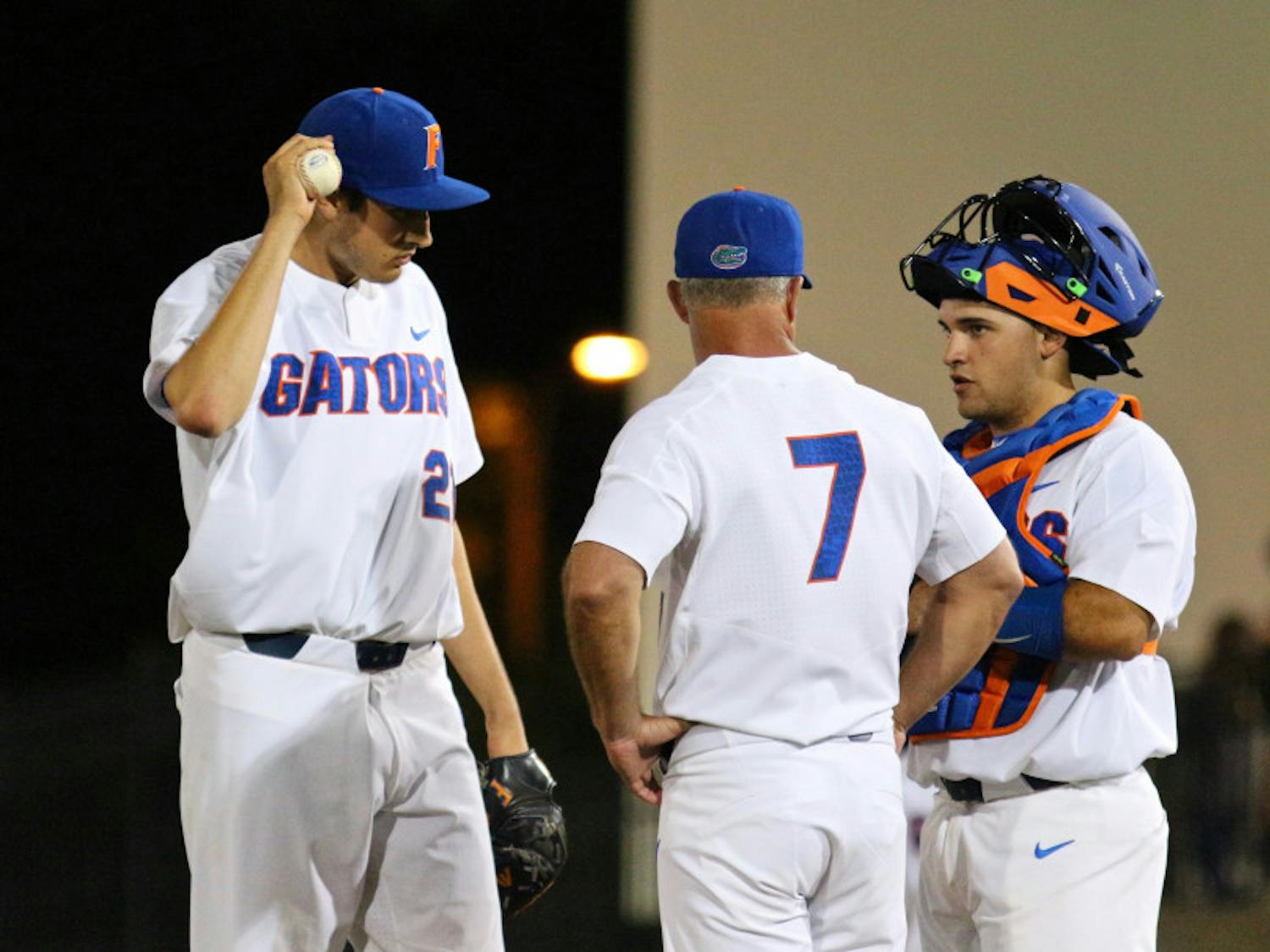 Alex Faedo (left), Kevin O'Sullivan (center) and Mike Rivera convene at the mound during Florida's 1-0 win against LSU on March 24, 2017, at McKethan Stadium.