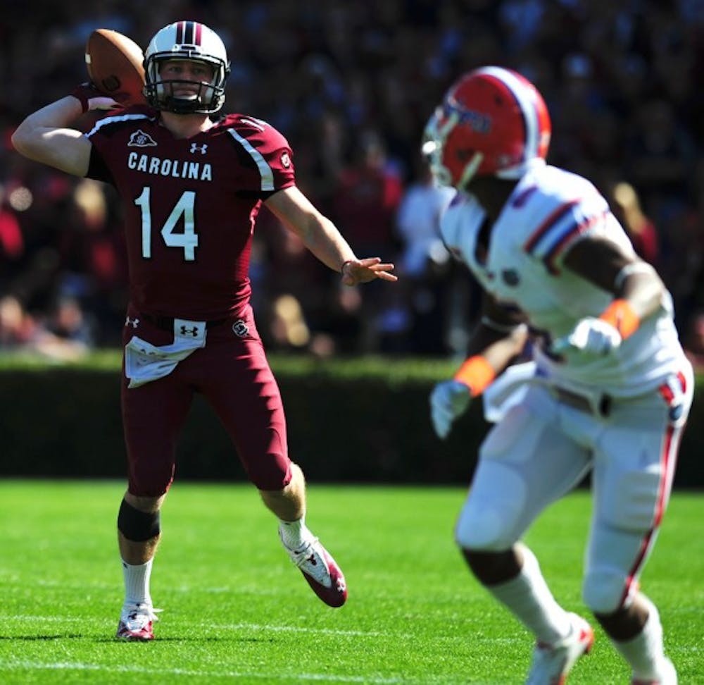 <p>South Carolina quarterback Connor Shaw throws against Florida in a 17-12 win Nov. 12. Shaw threw 14 touchdown passes and ran for eight last season.</p>
