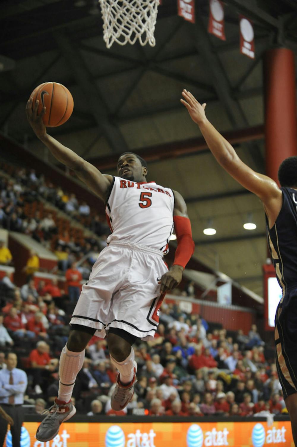 <p>Former Rutgers guard Eli Carter attempts a layup during a 68-65 victory against George Washington University on Dec. 11, 2012.</p>