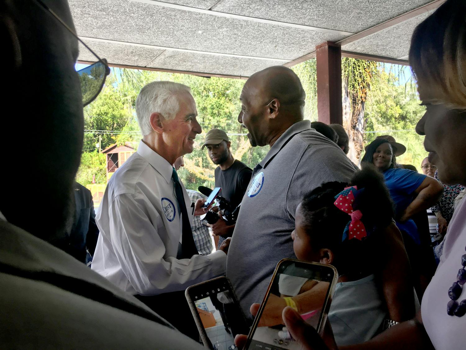 Democratic gubernatorial candidate Charlie Crist greets J.W. Honeysucker, a 58-year-old pastor at Grace United Ministries and Gainesville resident﻿, at a campaign stop at the Alachua County Democratic Headquarters Saturday, Sept. 24, 2022. “I’m supporting him for the stance and the platform he’s running on,” Honeysucker said.