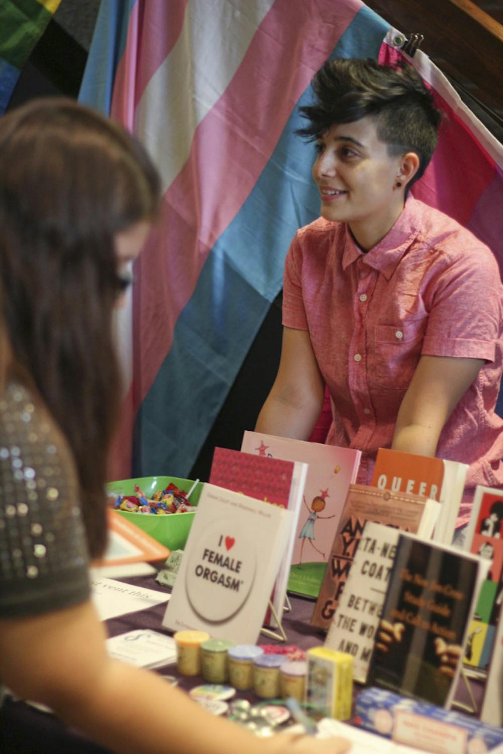 <p>Gabrielle Ricci, a 22-year-old UF psychology student, works the Wild Iris booth at the LGBTQ+ Welcome Assembly on Sept. 3, 2015. The assembly invited new students to be welcomed to the Gator Nation and learn about sexual orientation, gender identity and gender expression.</p>