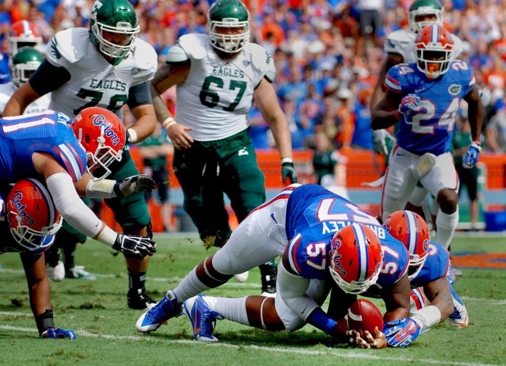 <p>Freshman defensive lineman Caleb Brantley recovers a fumble during Florida's 65-0 victory against Eastern Michigan on Saturday at Ben Hill Griffin Stadium.</p>