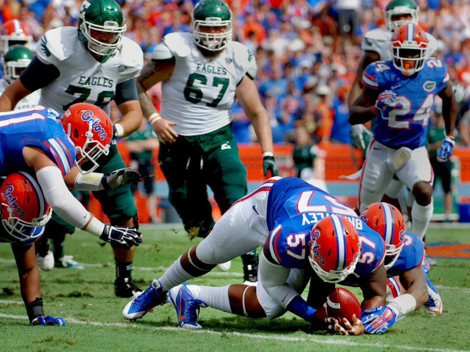 Freshman defensive lineman Caleb Brantley recovers a fumble during Florida's 65-0 victory against Eastern Michigan on Saturday at Ben Hill Griffin Stadium.