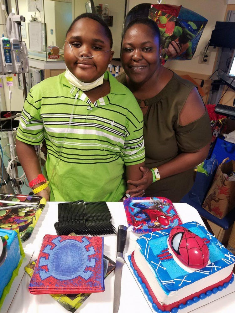 Lowell Thomas and his mother, Malika, celebrate Lowell’s 11th birthday Oct. 30 in the Congenital Heart Center at UF Health Shands Hospital. Lowell, a native of St. Croix, U.S. Virgin Islands, was diagnosed with a fatal heart condition in August while he and Mallika were on vacation in Jacksonville. 