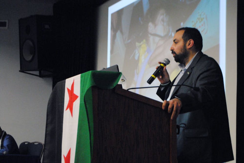 <p class="p1">Mohamad Khir Alwazir speaks of his experience as a survivor of a chemical weapons attack in Syria. The Arabic Cultural Association at UF and UF Amnesty International hosted the event Monday evening.&nbsp;</p>