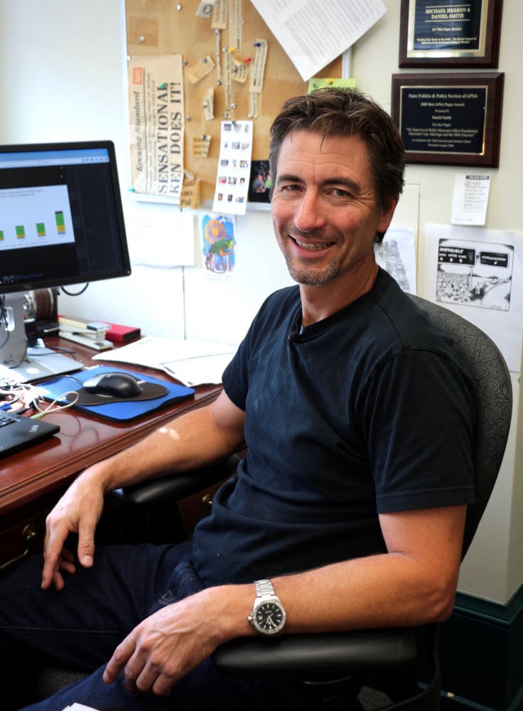 Daniel Smith, a UF political science professor, poses for a picture in his office. Along with another professor, he has collected and made voting data publicly available in Florida for the upcoming election.