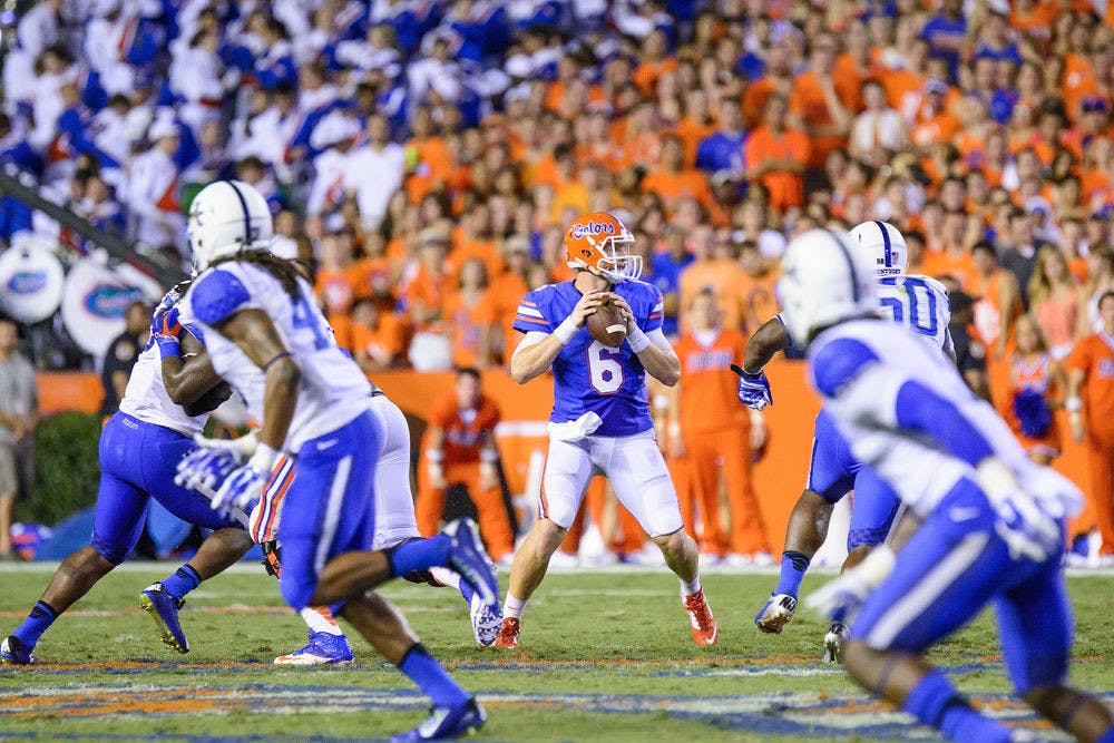 <p>UF quarterback Jeff Driskel drops back in the pocket to attempt a pass during Florida's 36-30 triple-overtime win against Kentucky on Saturday at Ben Hill Griffin Stadium.</p>