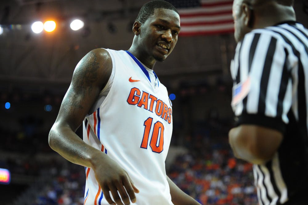 Florida forward Dorian Finney-Smith talks to a ref about a call during No. 19 Florida's 67-61 win against No. 13 Kansas on Dec. 10 in the O'Connell Center.