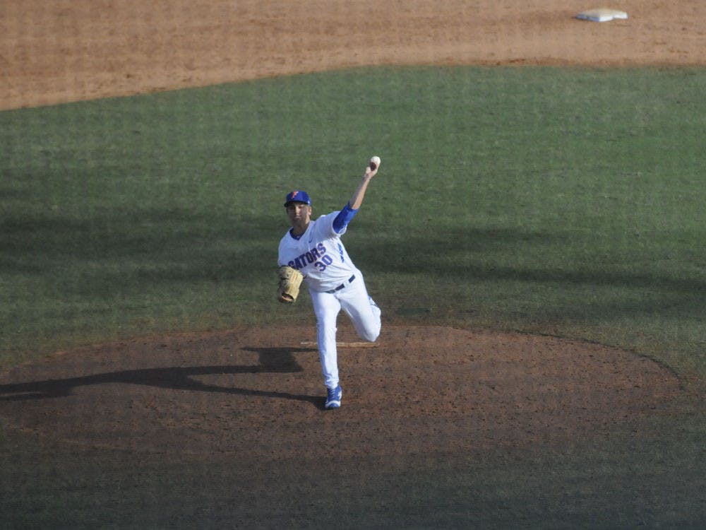 <p>Scott Moss pitches during Florida's 12-3 win against Florida Gulf Coast on Feb. 21, 2016 at McKethan Stadium.</p>