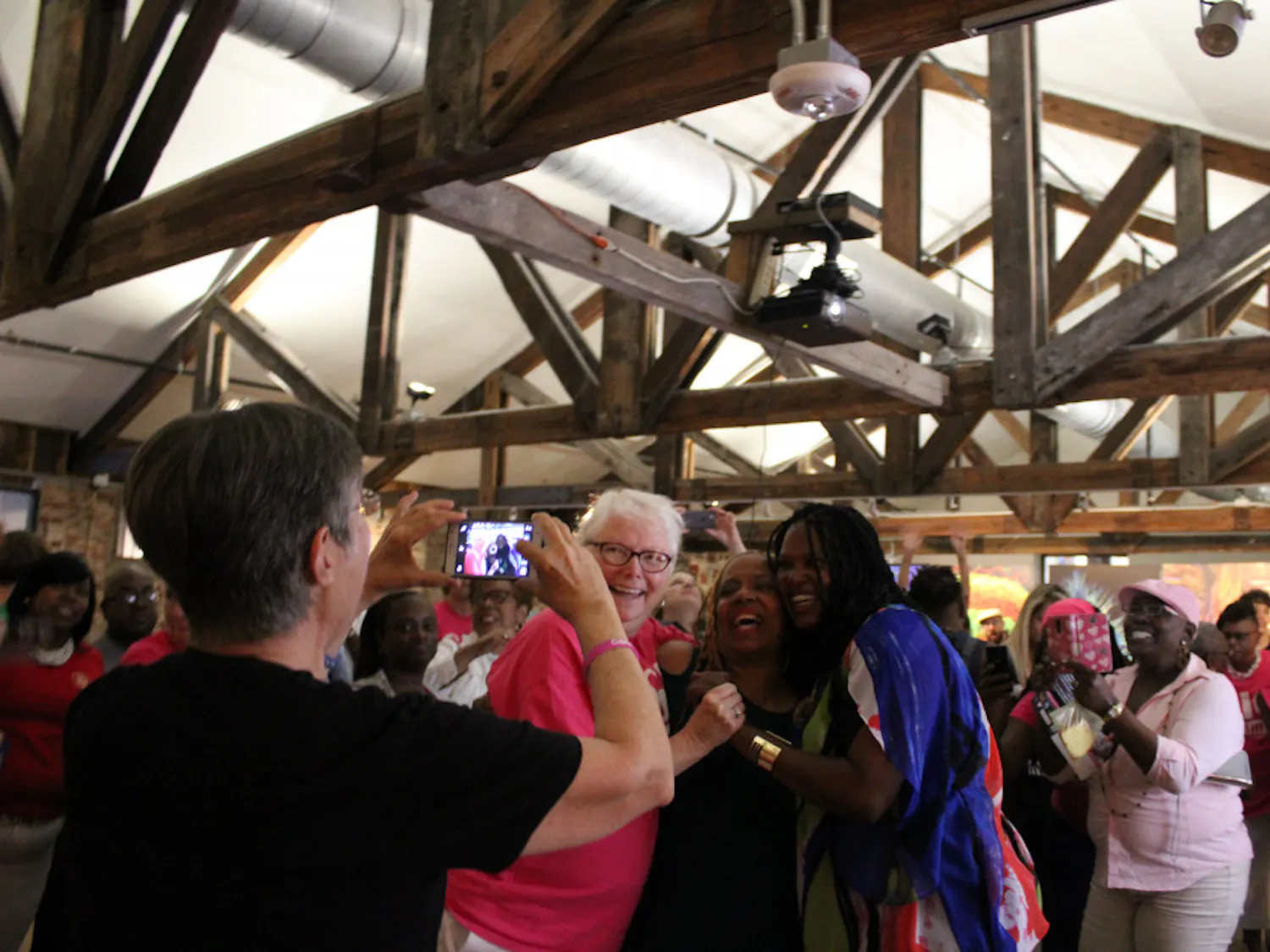 District 1 Commissioner-elect Gigi Simmons (right) celebrates with friends and supporters after winning the runoff election between her and incumbent Charles Goston.