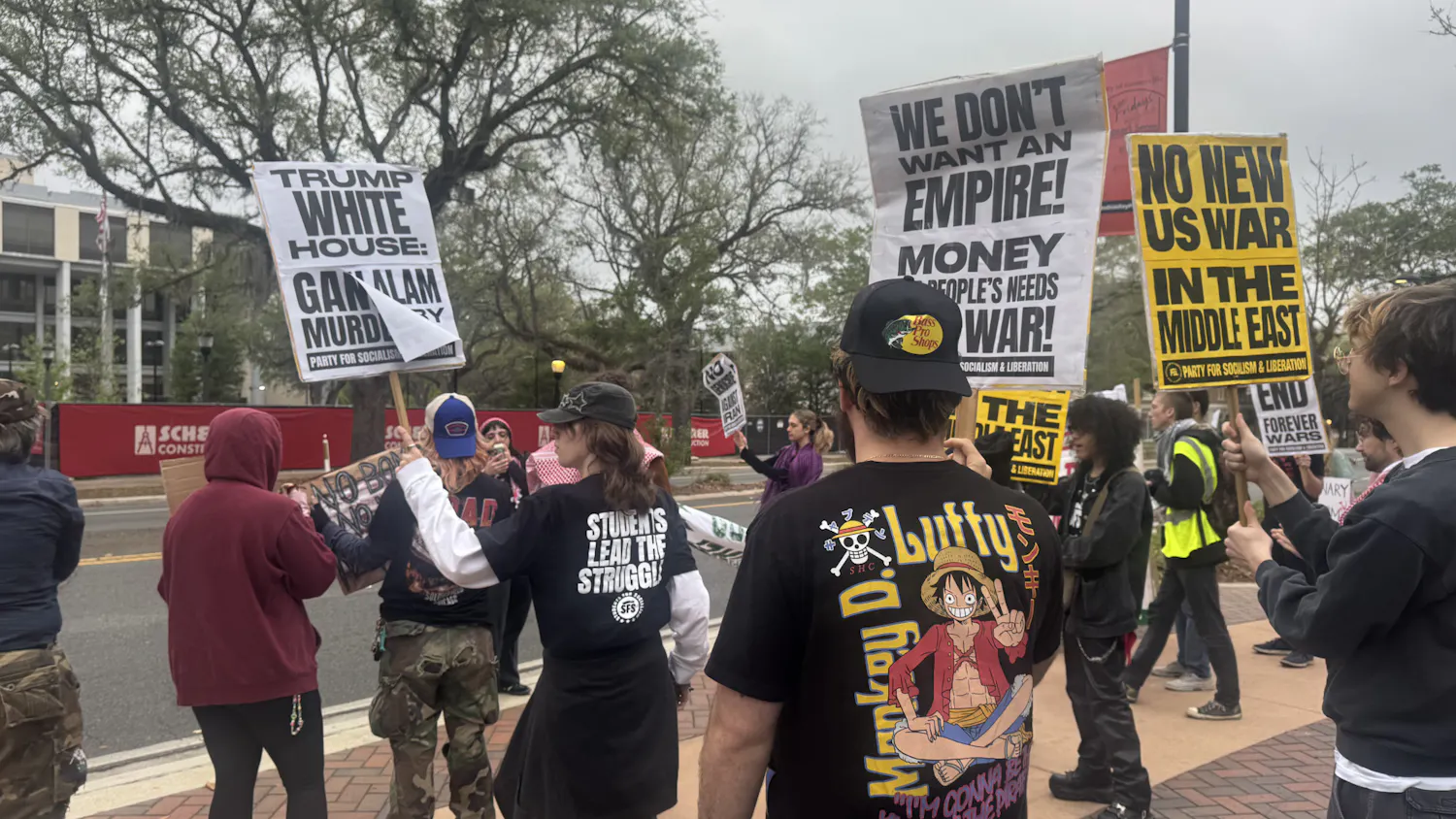Protestors against the U.S. war in Iran gather in front of the Alachua County Clerk’s Office, Wednesday, April 8, 2026, in Gainesville, Fla.