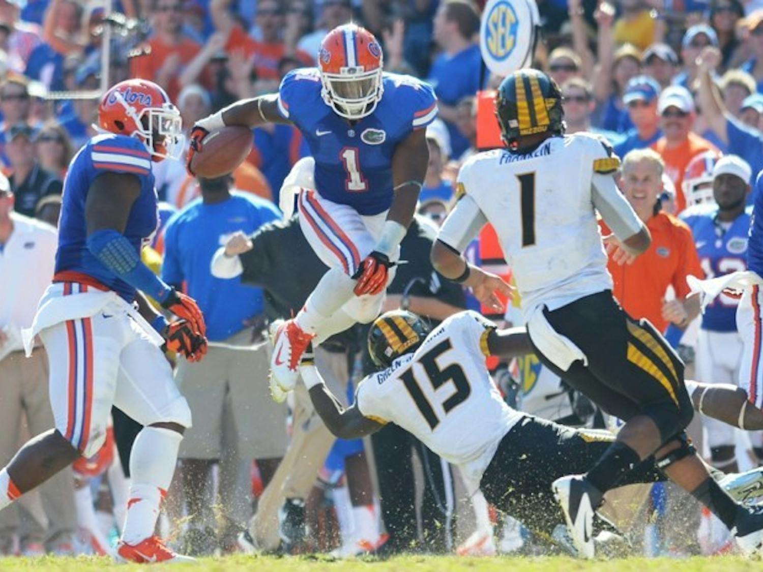 Linebacker Jon Bostic (1) attempts to hurdle Missouri wideout Dorial Green-Beckham (15) after making an interception during the fourth quarter of Florida’s 14-7 win on Saturday at Ben Hill Griffin Stadium.