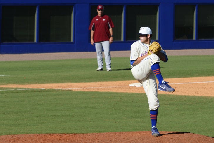 Junior pitcher Daniel Gibson winds up for a pitch during Florida’s 14-5 win against South Carolina on Saturday at McKethan Stadium. Gibson allowed two home runs during the seventh inning in Florida's 9-2 loss to Georgia on Saturday.&nbsp;