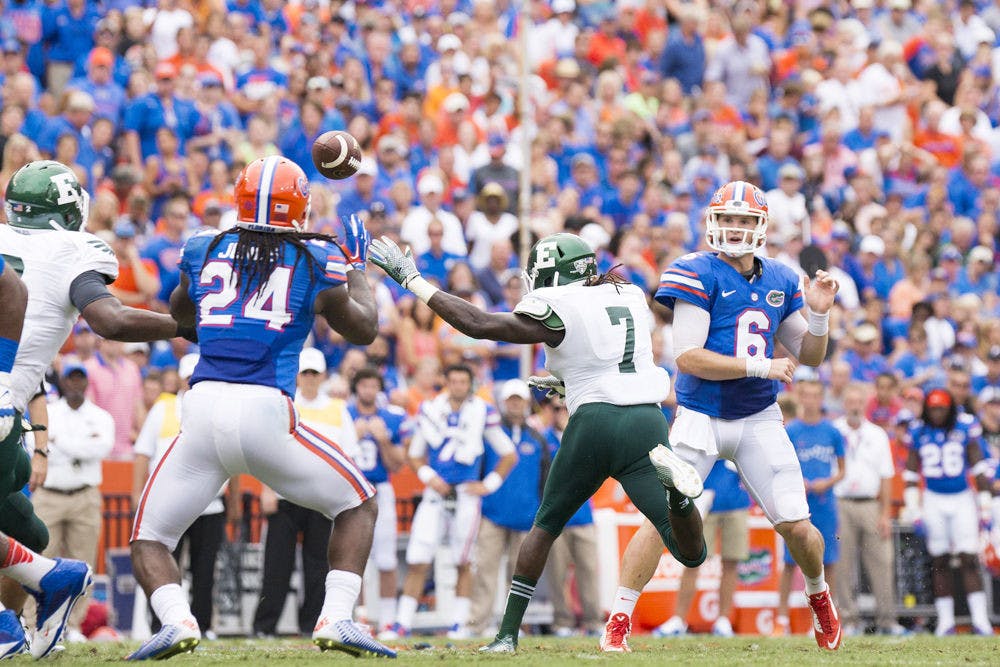 Jeff Driskel (6) passes to Matt Jones (24) during Florida's 65-0 win against Eastern Michigan on Saturday at Ben Hill Griffin Stadium.