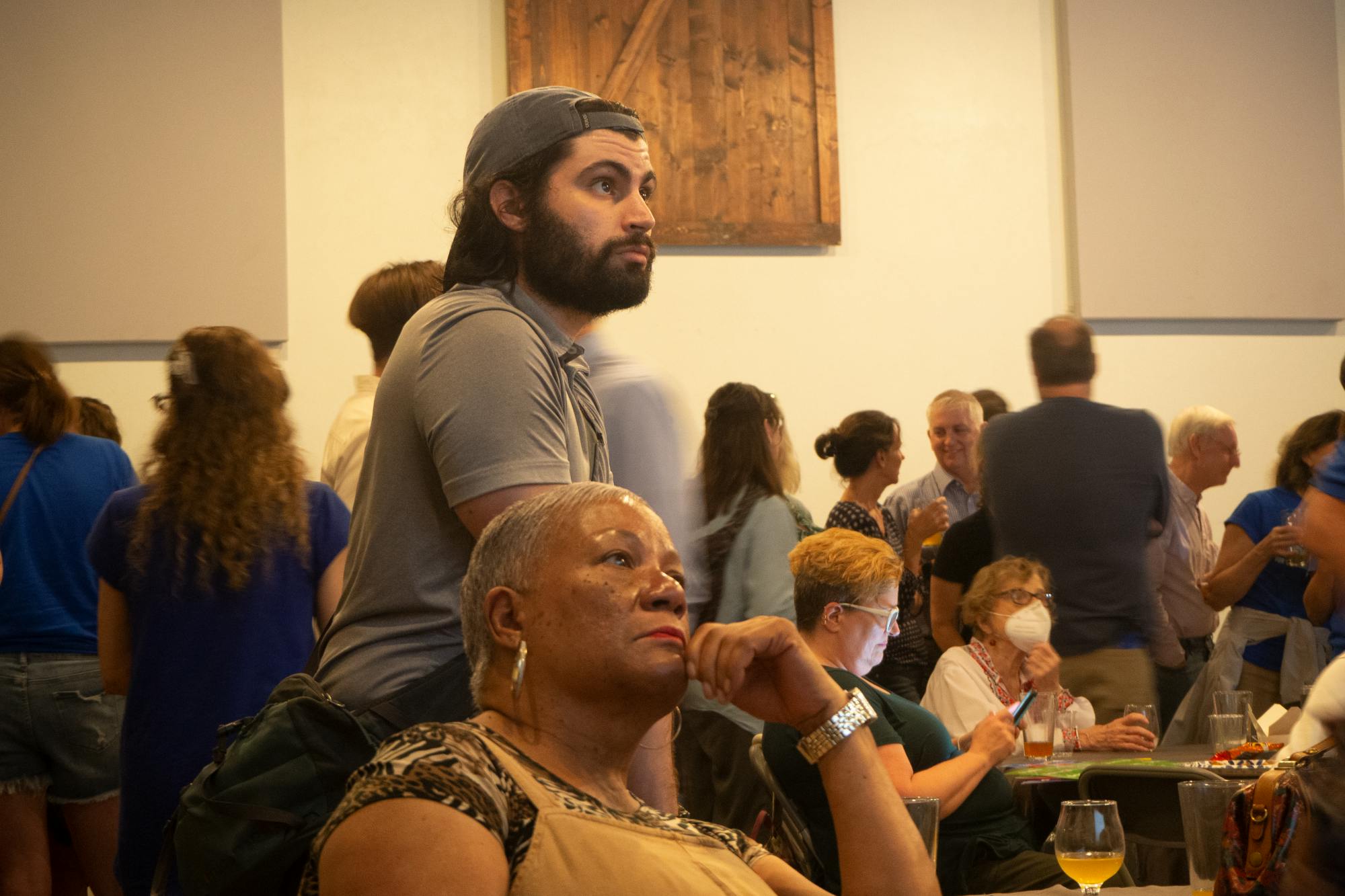 Voters watch as election results release at an election watch party at Cypress & Grove Brewing Company Aug. 23.