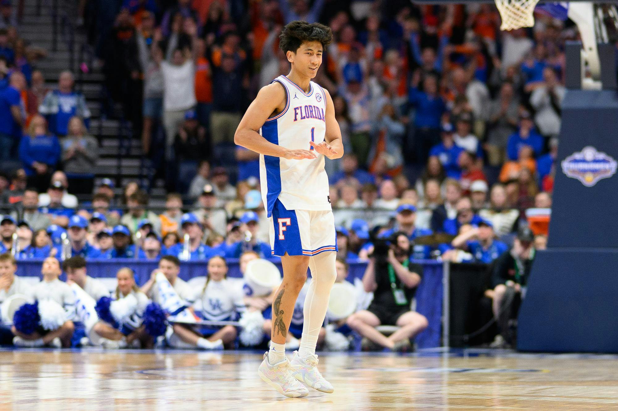 Florida guard Xaivian Lee (1) celebrates a three point shot during the second half of an SEC Men's Basketball Tournament quarterfinal game against Kentucky, Friday, March 13, 2026, in Nashville, Tenn.
