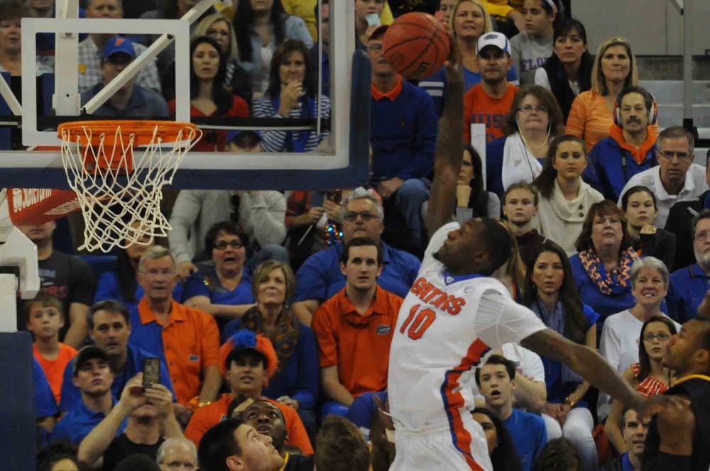Dorian Finney-Smith dunks during Florida’s win over West Virginia on Jan. 30, 2016, in the O’Connell Center.