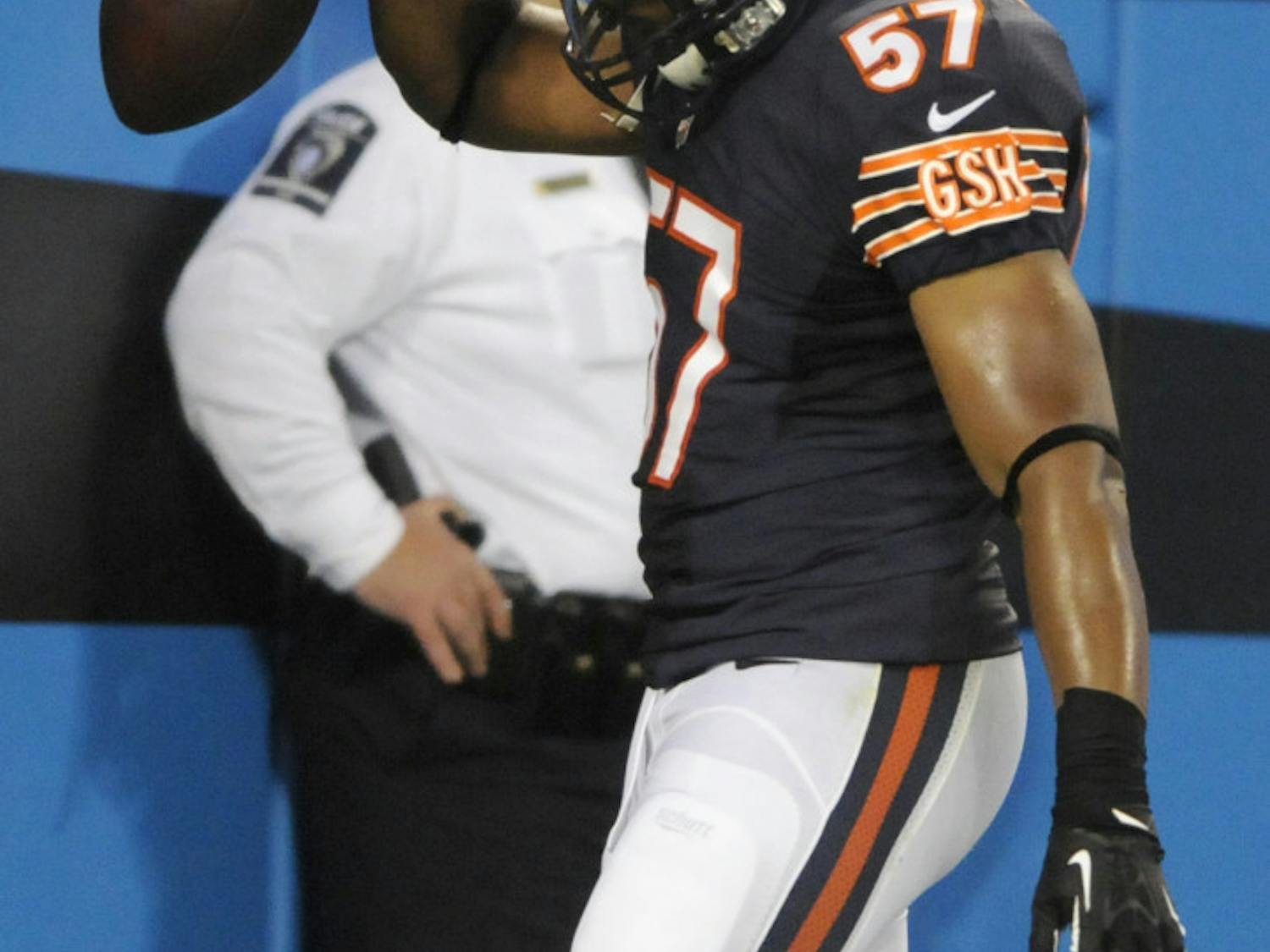 Chicago Bears' Jon Bostic (57) spikes the ball in the end zone after returning an interception for a touchdown against the Carolina Panthers during the first half of a preseason NFL football game in Charlotte, N.C., on Aug. 9.