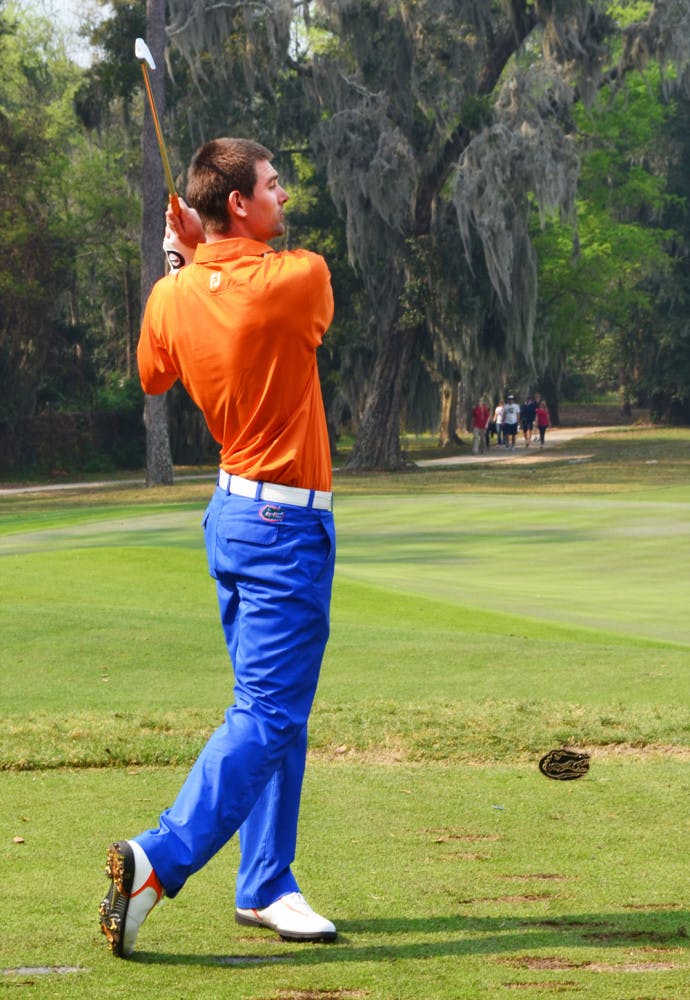 Senior T.J. Vogel eyes his shot during the SunTrust Gator Invitational at Mark Bostick Golf Course on Sunday. Vogel is back with the Gators after competing in The Masters.