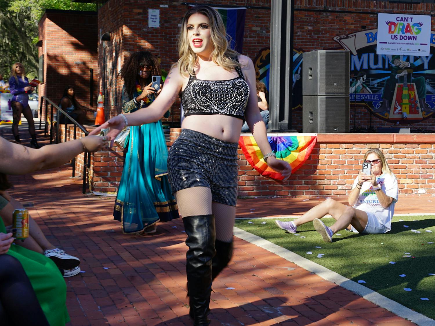 Drag queen Jessa Belle Light performing to a medley of Taylor Swift songs at Bo Diddley Plaza on Saturday, Oct. 21, 2023.
