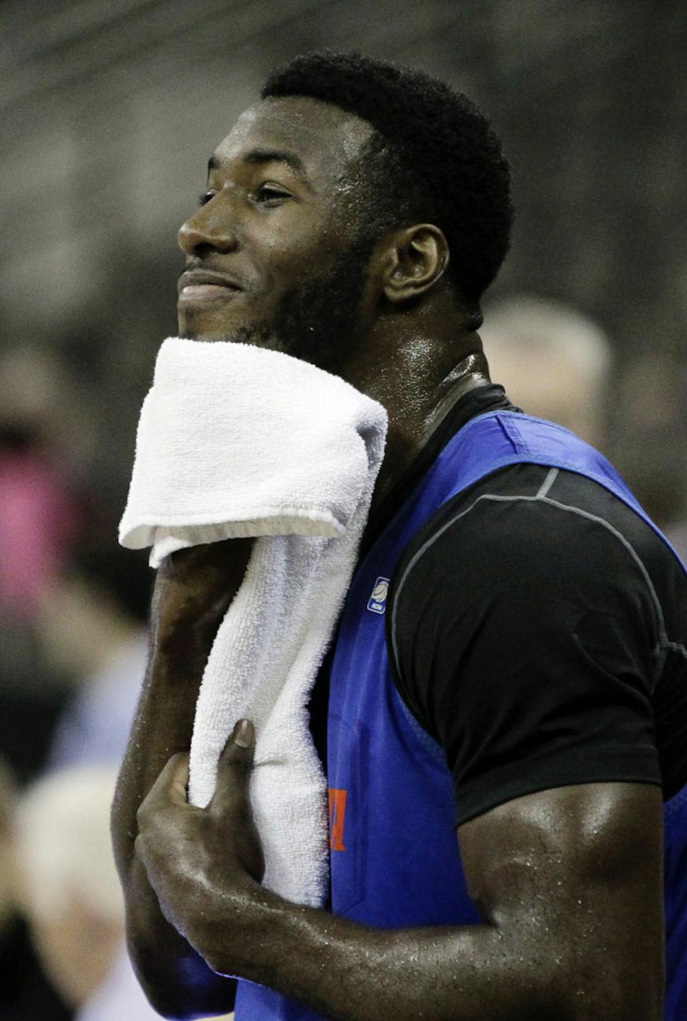 <p>Florida center Patric Young towels off during a practice last week in Omaha, Neb. Young and Marquette forward Jae Crowder have gone back and forth in the media this week ahead of their Sweet 16 meeting tonight in Phoenix.</p>