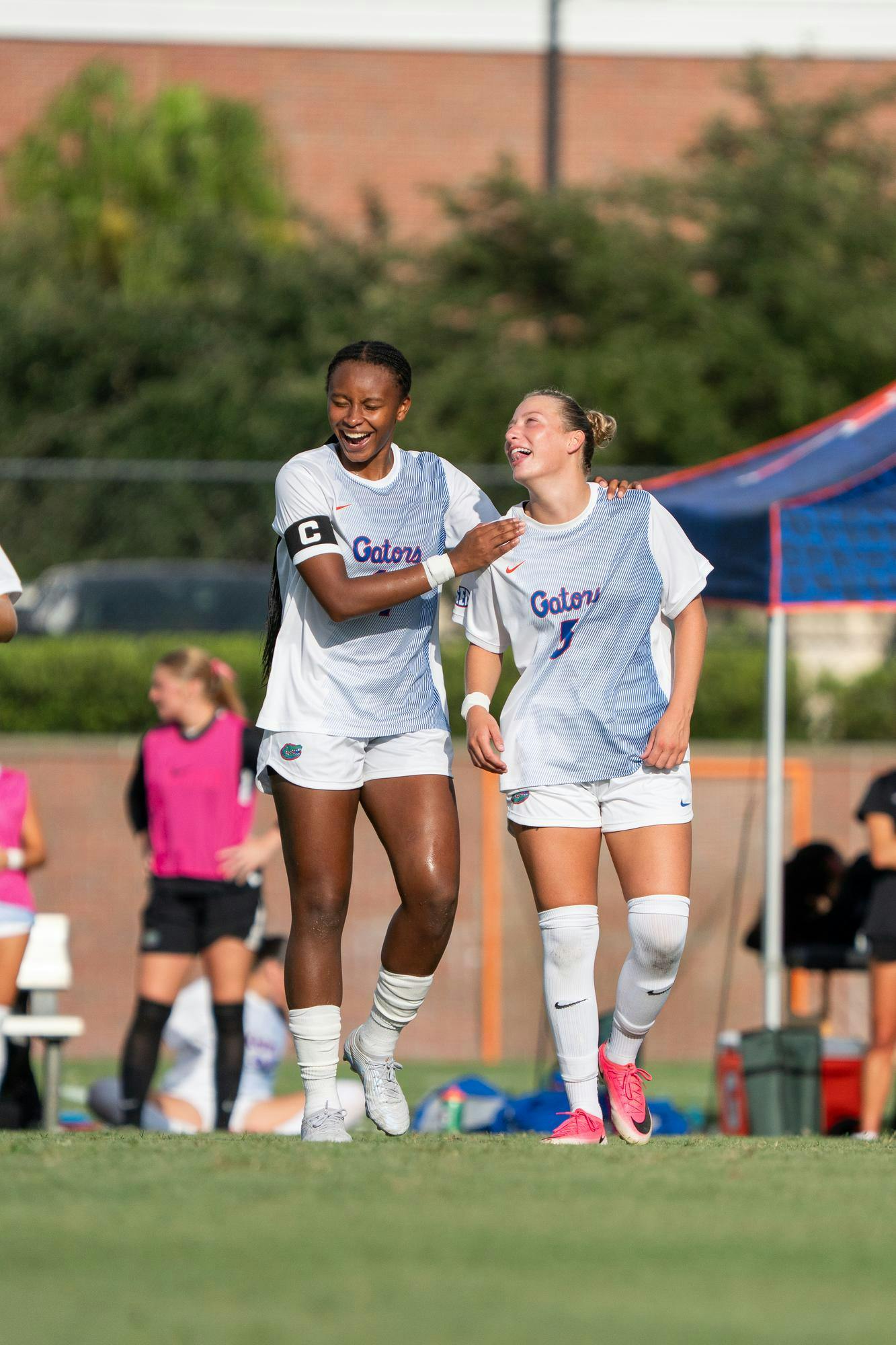 Florida Gator's defender Hannah Jibril and midfield Mia Gray laughing in conversation prior to beginning match against Jacksonville Dolphins, at Donald R. Dizney Stadium in Gainesville, Fla. Thursday, Aug 27th.