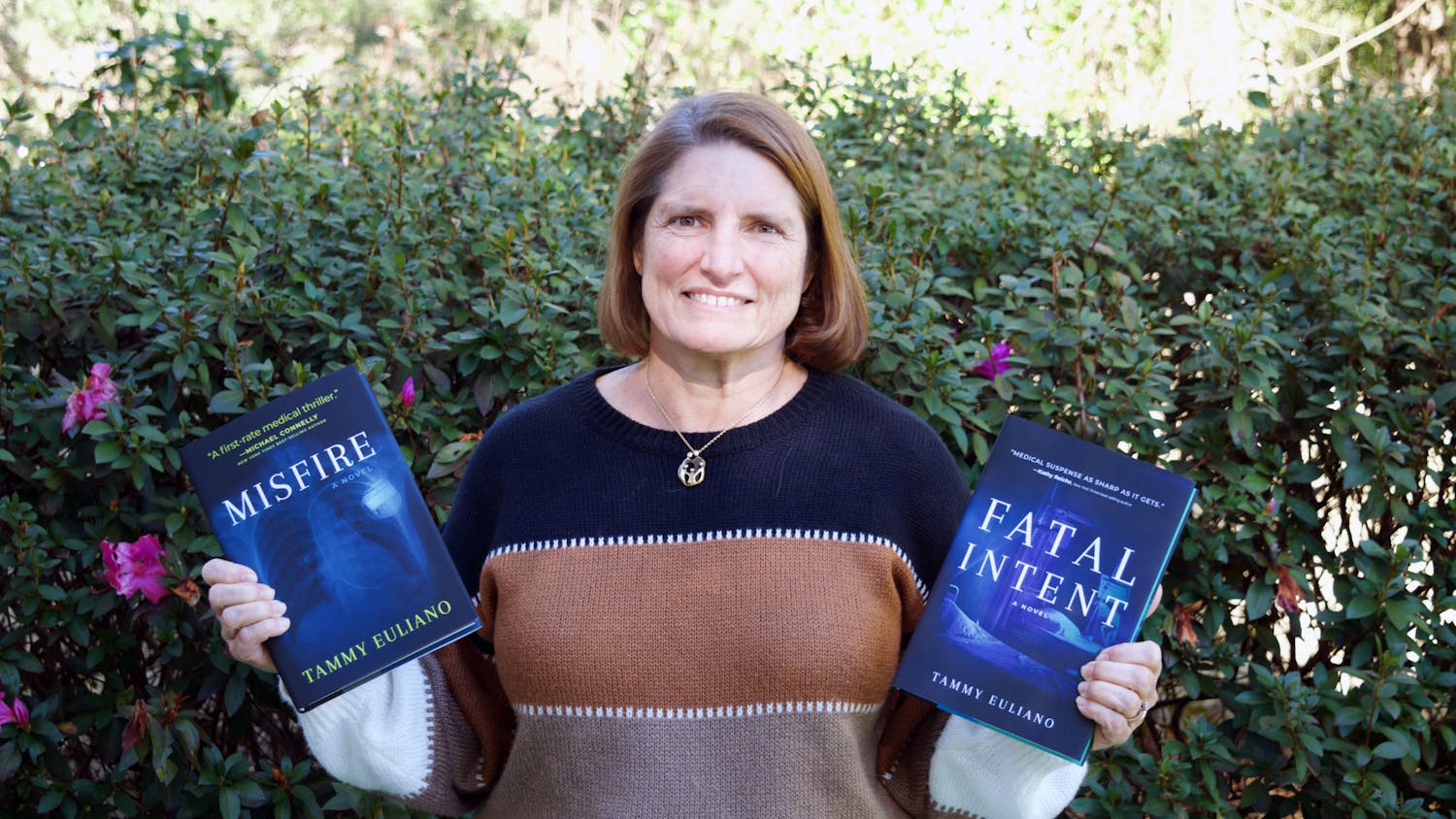 Author and anesthesiologist Dr. Euliano holds her books &quot;Fatal Intent&quot; and &quot;Misfire,&quot; the newest of the Kate Downey medical mystery Monday, Jan. 16, 2023. 