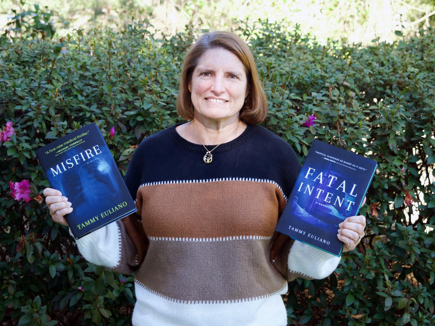Author and anesthesiologist Dr. Euliano holds her books &quot;Fatal Intent&quot; and &quot;Misfire,&quot; the newest of the Kate Downey medical mystery Monday, Jan. 16, 2023. 