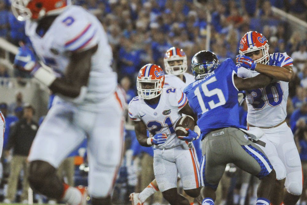 <p>UF running back Kelvin Taylor rushes during Florida's 14-9 win against Kentucky on Sept. 19, 2015, at Commonwealth Stadium in Lexington, Kentucky.</p>