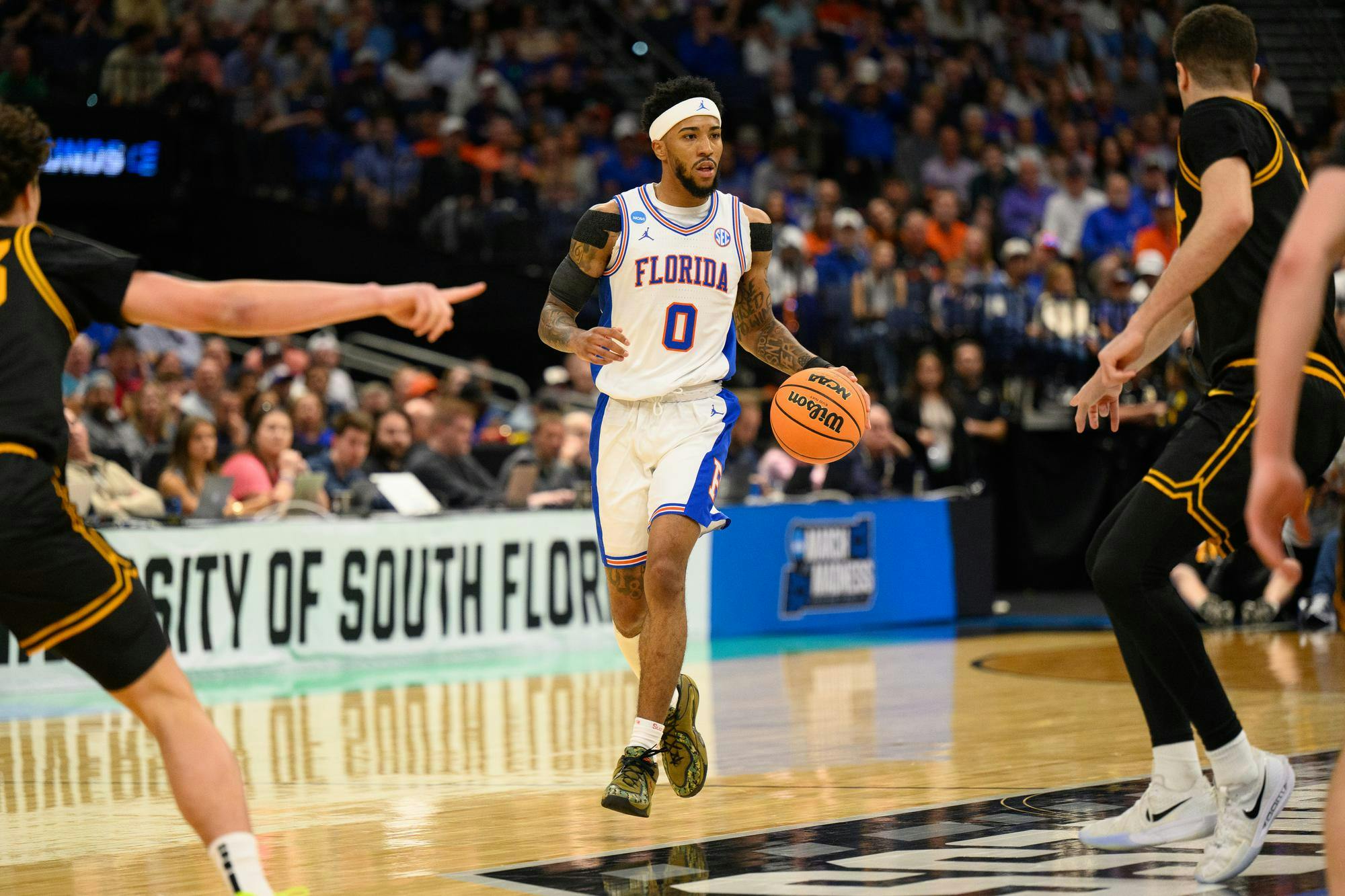 Florida guard Boogie Fland (0) dribbles during the first half of an NCAA Tournament second round game against Iowa, Sunday, March 22, 2026, in Tampa, Fla.