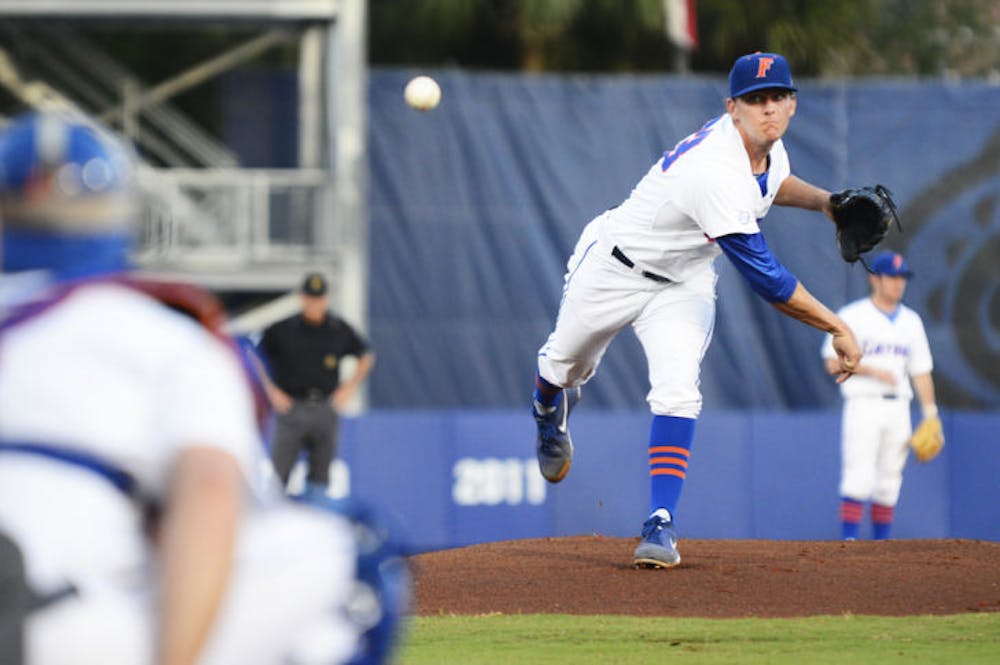 <p class="p1"><span class="s1">Junior Jonathon Crawford warms up on the mound during Florida’s 3-2 win against South Carolina on April 11 at McKethan Stadium. Crawford and No. 3 seed&nbsp;Florida will face No. 2 seed Austin Peay in its first NCAA Tournament game on Friday.&nbsp;</span></p>