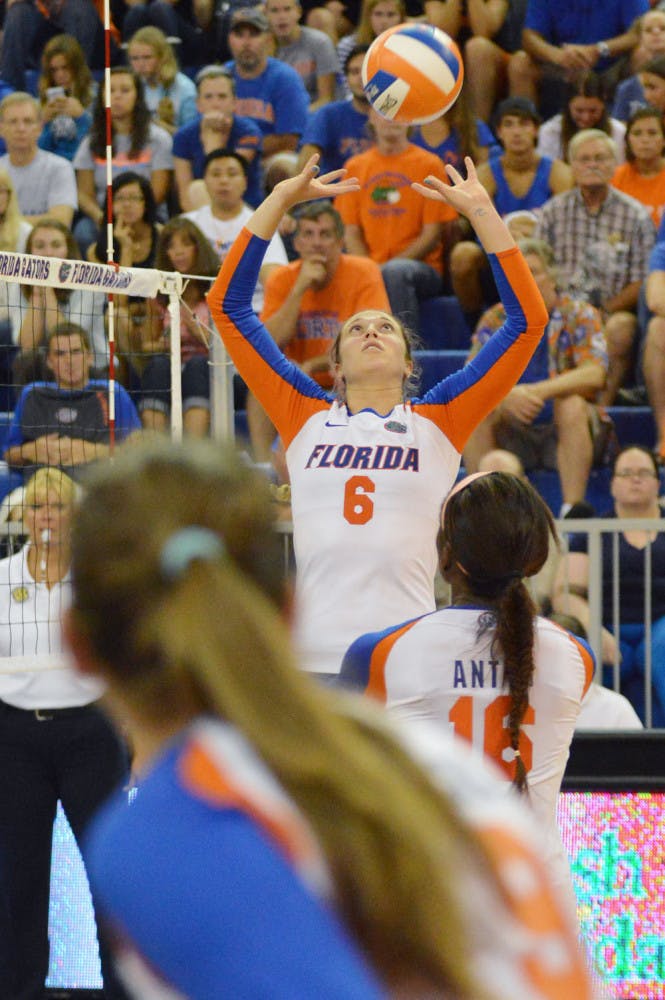 Mackenzie Dagostino (6) sets the ball during Florida's 3-0 win against Idaho on Aug. 30 in the O'Connell Center