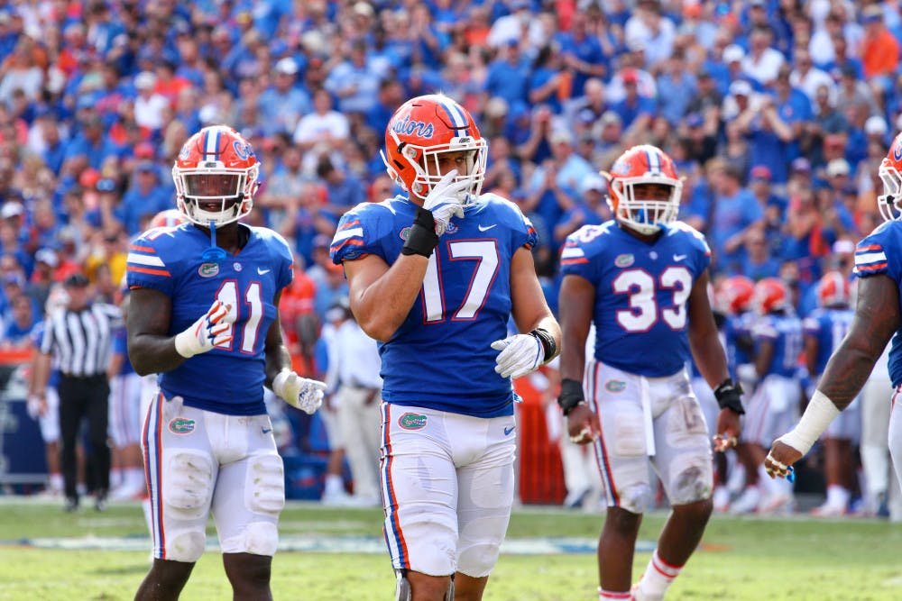 <p>Vosean Joseph (left), Jordan Sherit (middle) and David Reese get ready on defense during Florida's 17-16 loss against LSU on Saturday at Ben Hill Griffin Stadium.</p>