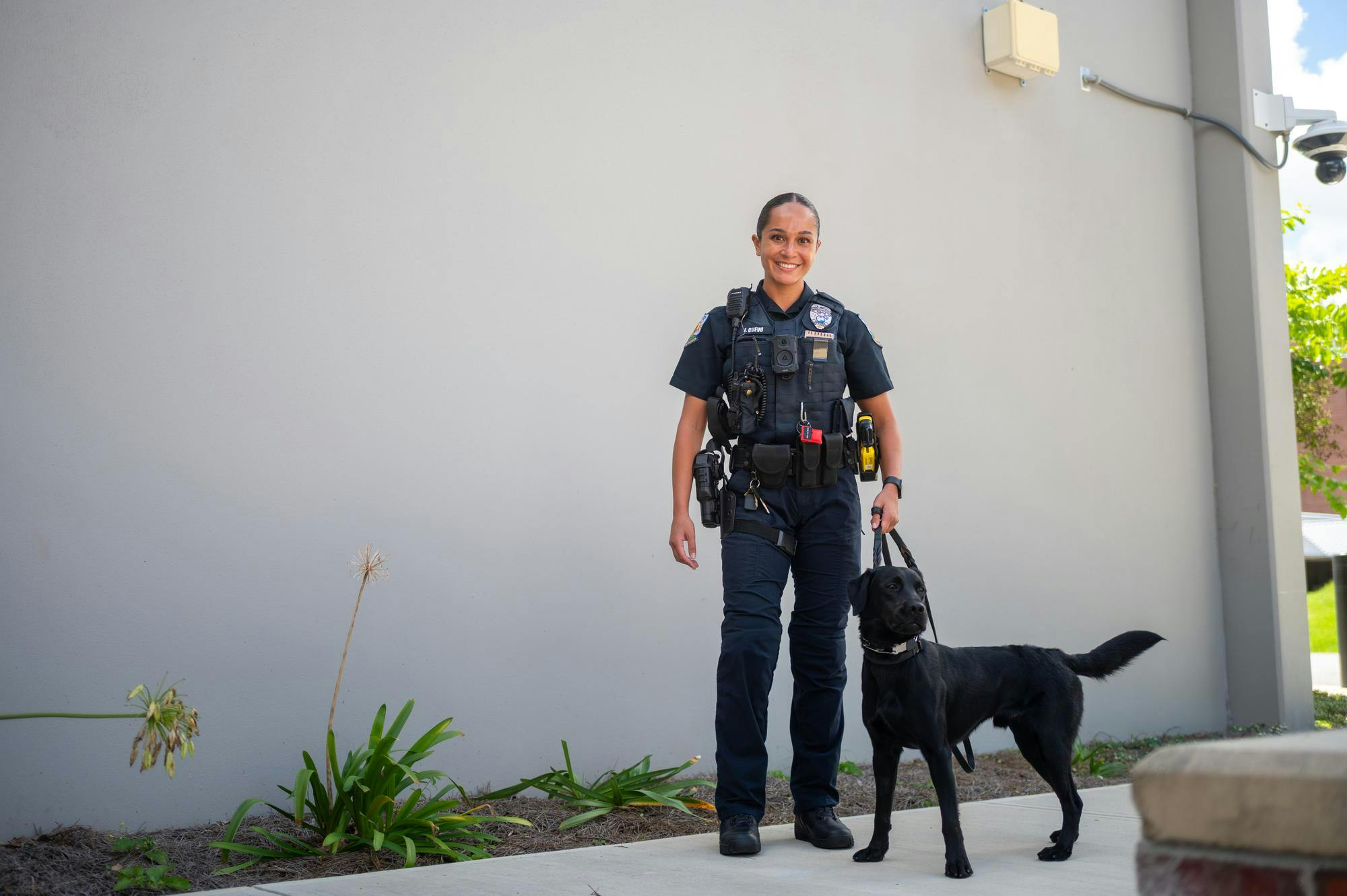 Officer Jenna Cuevo poses with UFPD’s newest police dog, Maverick, in front of the UF Public Safety Building, Monday, Aug. 31, 2026, in Gainesville, Fla.