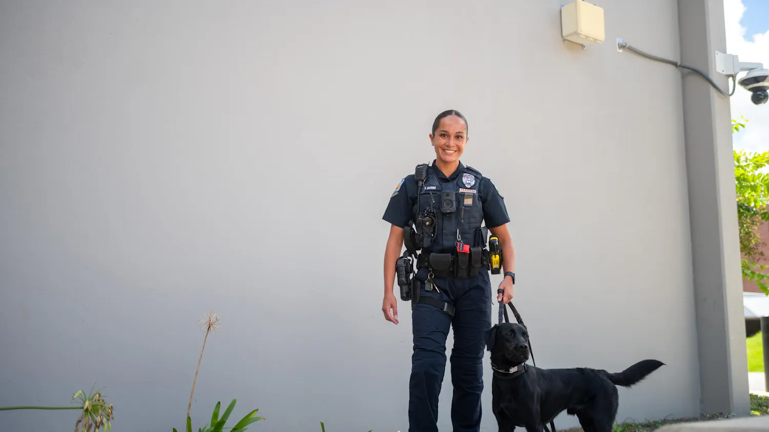 Officer Jenna Cuevo poses with UFPD’s newest police dog, Maverick, in front of the UF Public Safety Building, Monday, Aug. 31, 2026, in Gainesville, Fla.