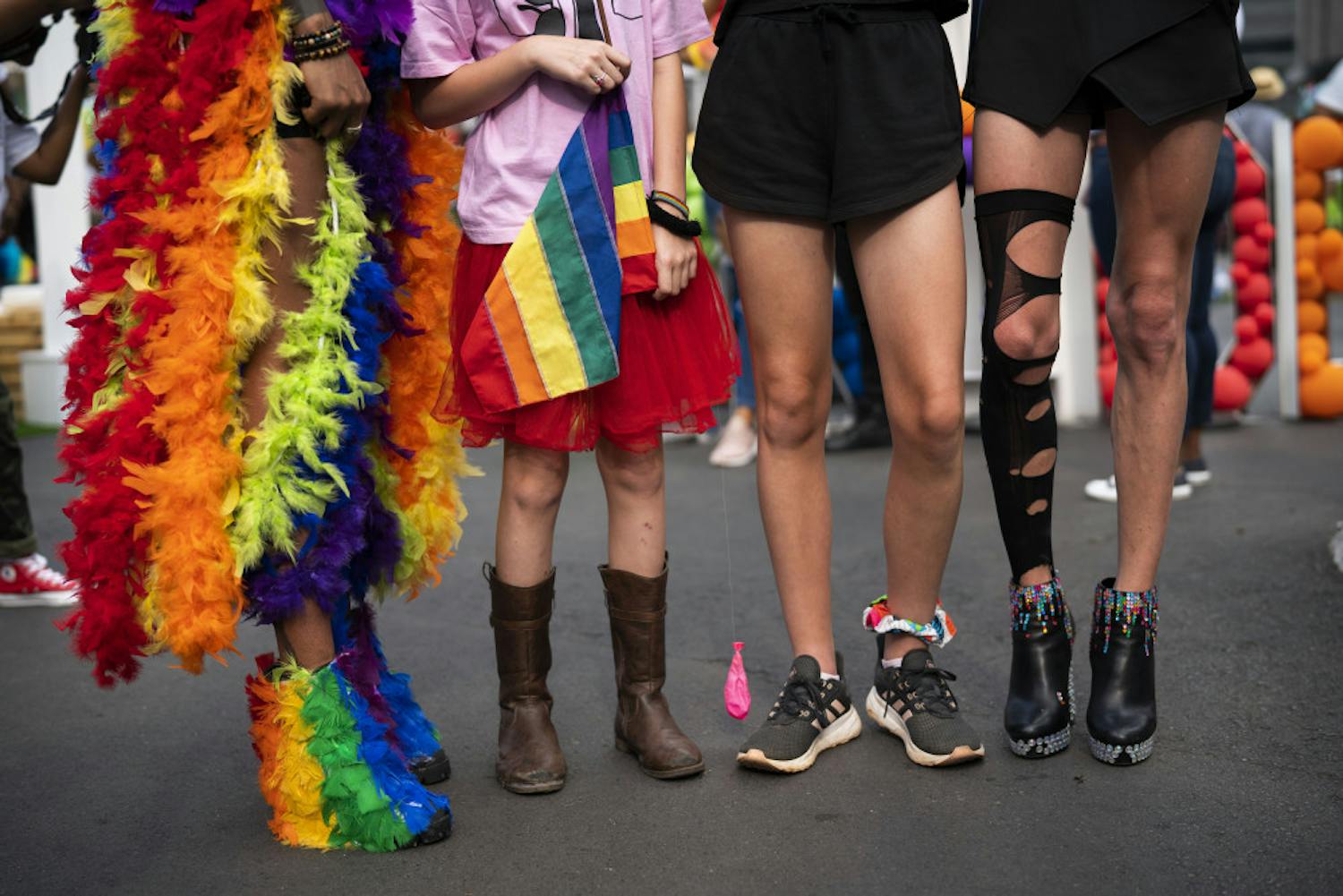 The legs of costumed people participating in the annual Gay Pride event in Johannesburg, South Africa, Saturday Oct. 26, 2019. Thousands took part in this 30th edition of the Gay Pride. (AP Photo/Jerome Delay)