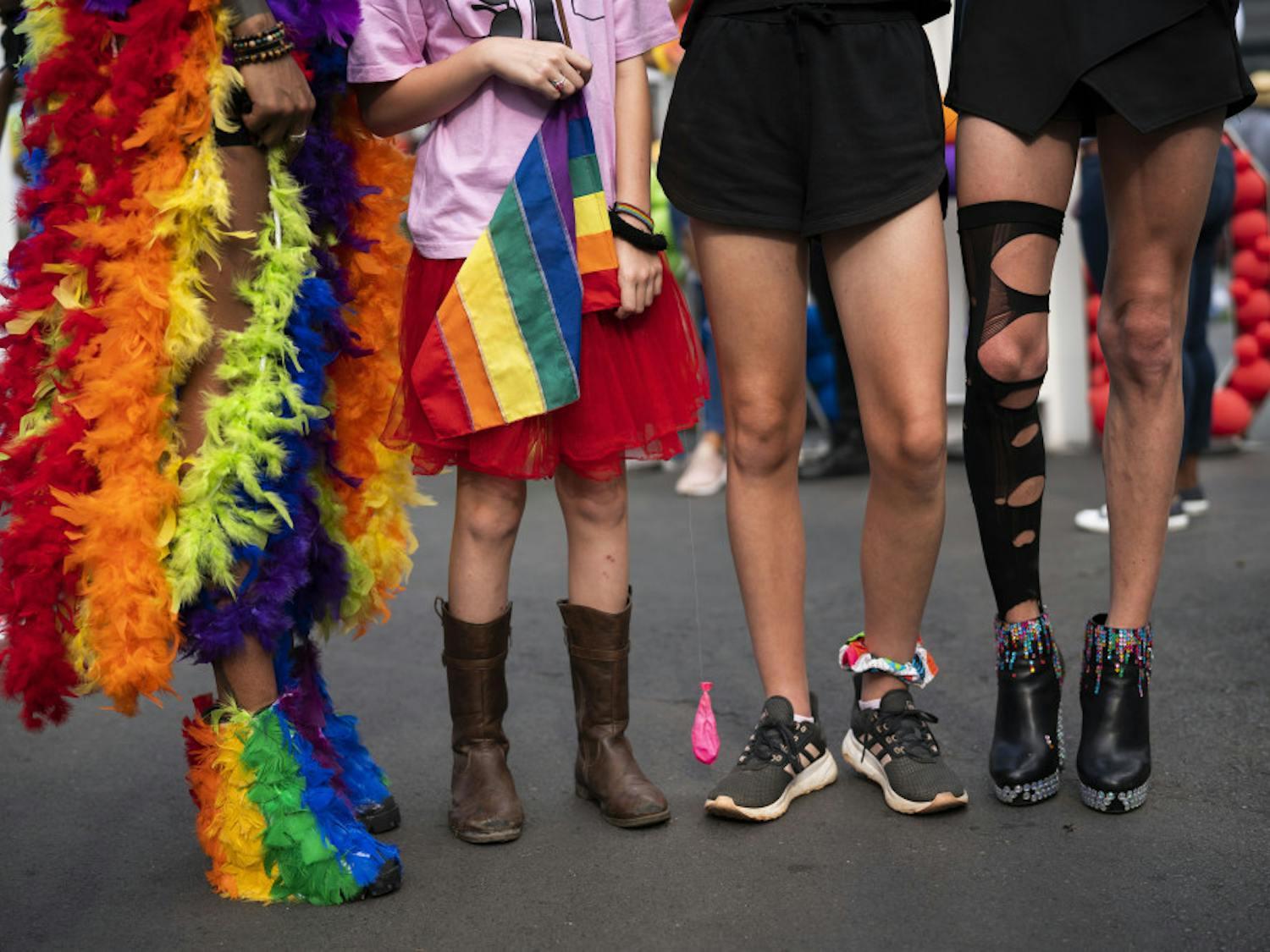 The legs of costumed people participating in the annual Gay Pride event in Johannesburg, South Africa, Saturday Oct. 26, 2019. Thousands took part in this 30th edition of the Gay Pride. (AP Photo/Jerome Delay)