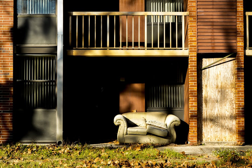 <p>An old couch sits as the last remnant of an abandoned dorm in Maguire Village on Monday, January 20, 2025.</p>