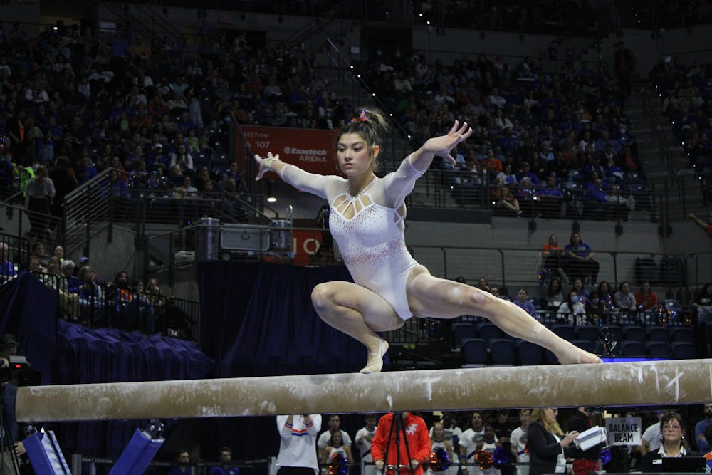 Freshman Kayla DiCello performs her beam routine in a quad meet against the West Virginia Mountaineers, Ball State Cardinals and Lindenwood Lions Friday, Jan. 6, 2023. 
