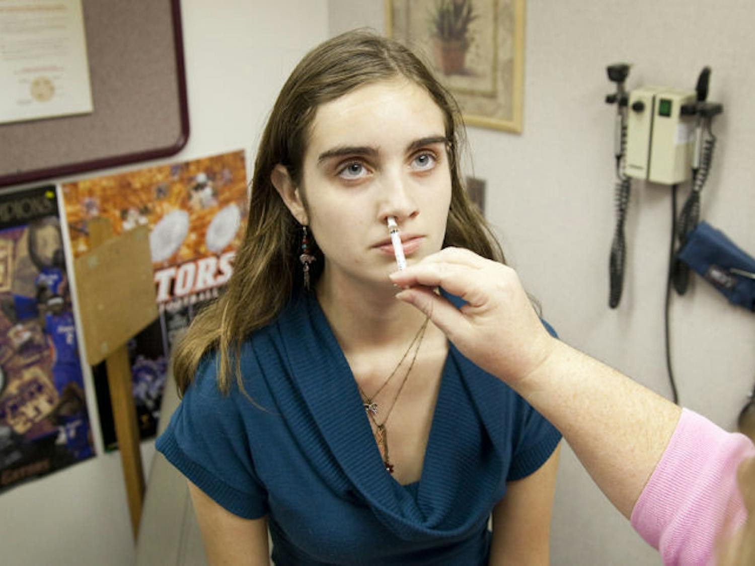 UF student Victoria Reynolds receives a nasal spray vaccine for H1N1 during a mass vaccination of 800 students throughout Wednesday at the Infirmary.