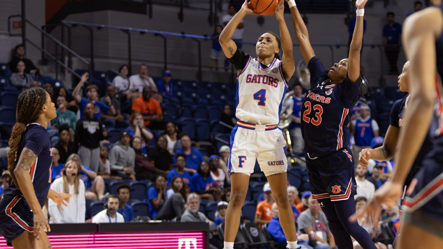 Senior Zippy Broughton attempts a shot against an Auburn defender in the Gators' 77-74 loss against the Tigers, Sunday, March 3, 2024. 