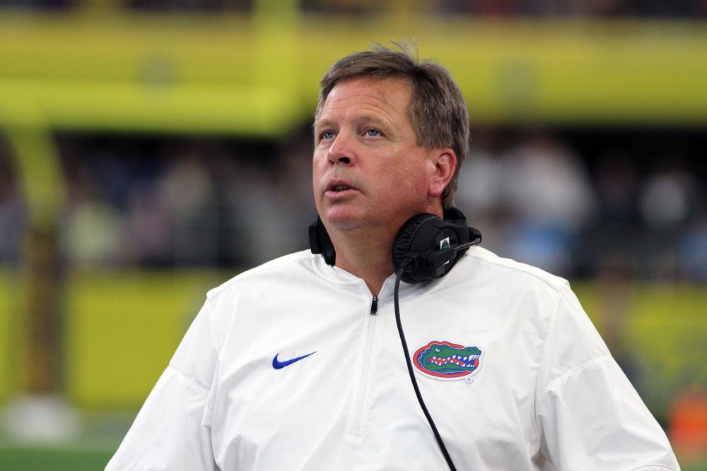 UF coach Jim McElwain looks on during Florida's 33-17 loss to Michigan on Saturday at AT&amp;T Stadium in Arlington, Texas.