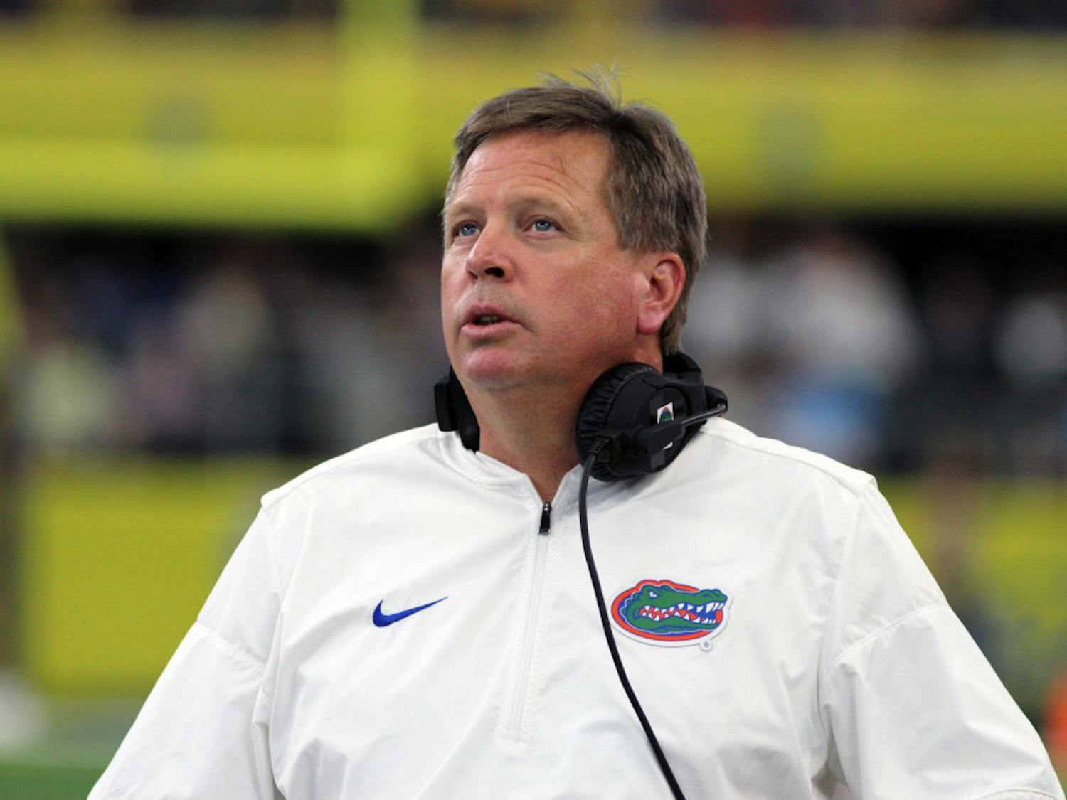 UF coach Jim McElwain looks on during Florida's 33-17 loss to Michigan on Saturday at AT&T Stadium in Arlington, Texas.