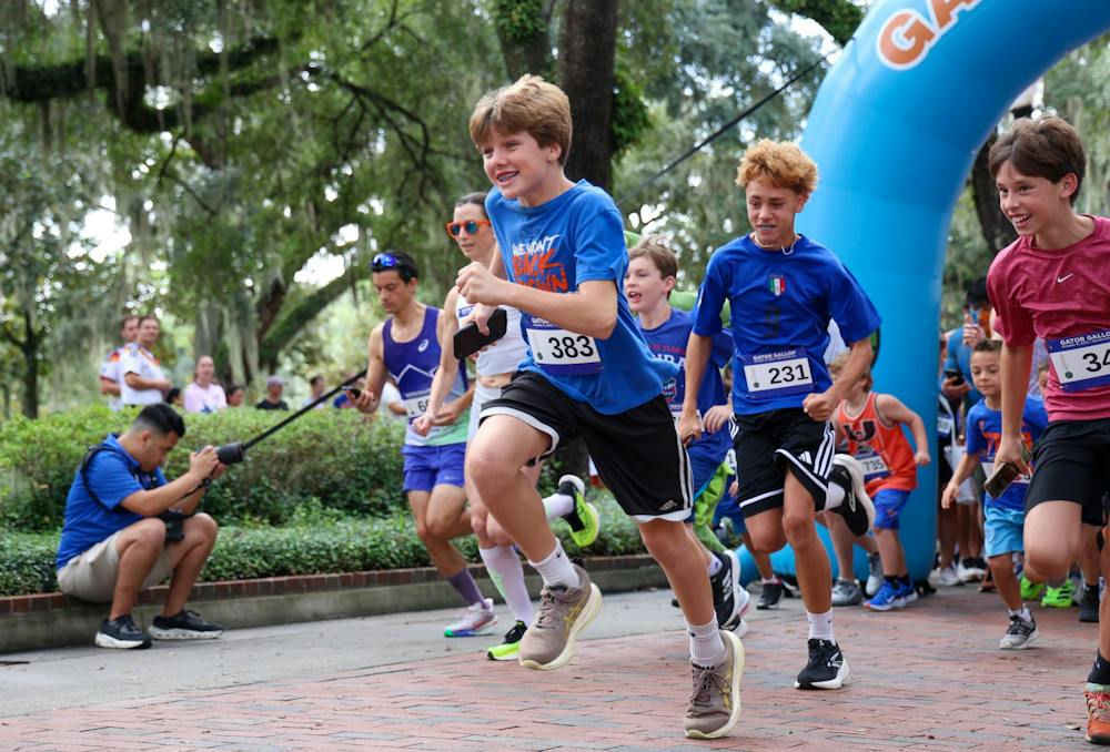 Participants of the 2025 Gator Gallop cross the starting line on Gainesville’s Plaza of the Americas. The Gator Gallop kicked off University of Florida’s Homecoming Weekend on Friday, Oct. 9, 2026.