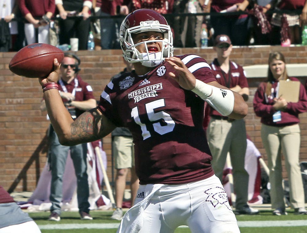 <p>Mississippi State quarterback Dak Prescott (15) throws a pass during the second half of an NCAA college football game against Texas A&amp;M in Starkville, Miss., Saturday, Oct. 4, 2014. MSU won 48-31.</p>