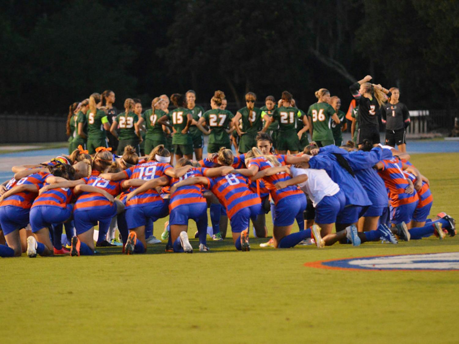 Florida (front) huddles prior to its 3-0 win against Miami on Aug. 22 at James G. Pressly Stadium.