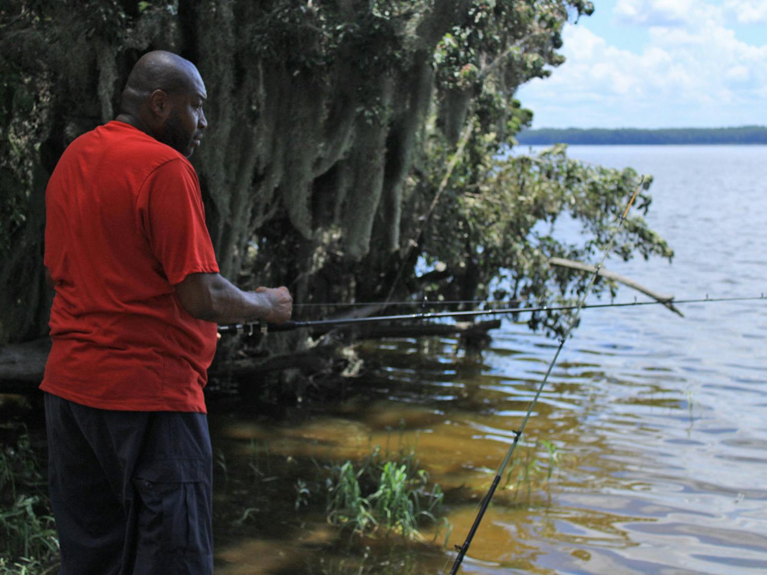 Ron Johnson, 55, spends his afternoon fishing at Newnans Lake on Saturday, July 29, 2023. 