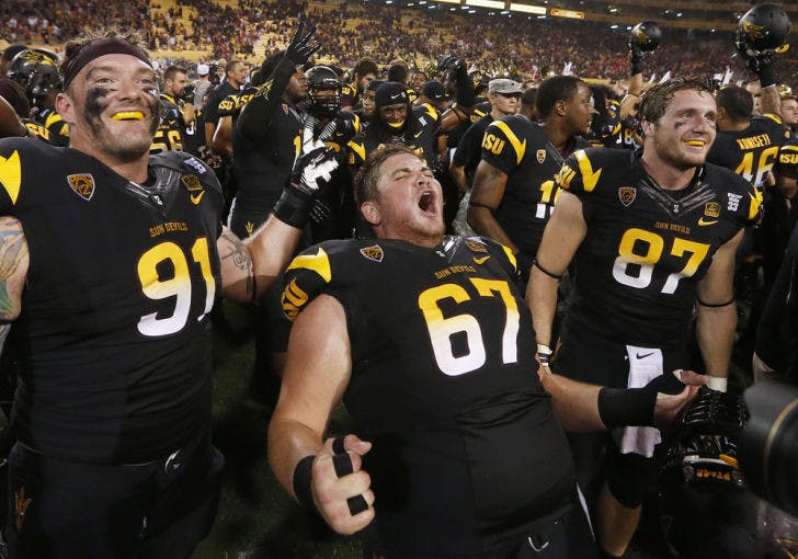 Arizona State’s Jake Sheffield (91), Kody Koebensky (67) and Chris Coyle (87) celebrate a 32-30 victory against Wisconsin on Saturday in Phoenix. Arizona State faces Stanford this weekend.