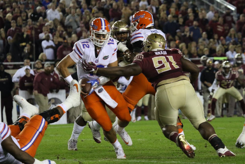 <p>Austin Appleby is pressured in the pocket during Florida's loss to FSU on Nov. 26, 2016, in Tallahassee.</p>