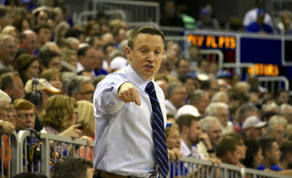 <p>UF coach Mike White calls out a play during Florida's 87-83 win over Arkansas on Feb. 3, 2016, in the O'Connell Center.&nbsp;</p>